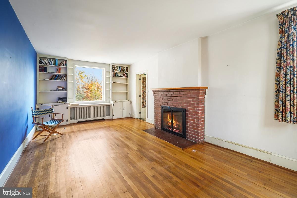 6540 Wiscasset Road Bethesda, MD 20816 - Photo 8 of 33 an empty room with windows and fireplace