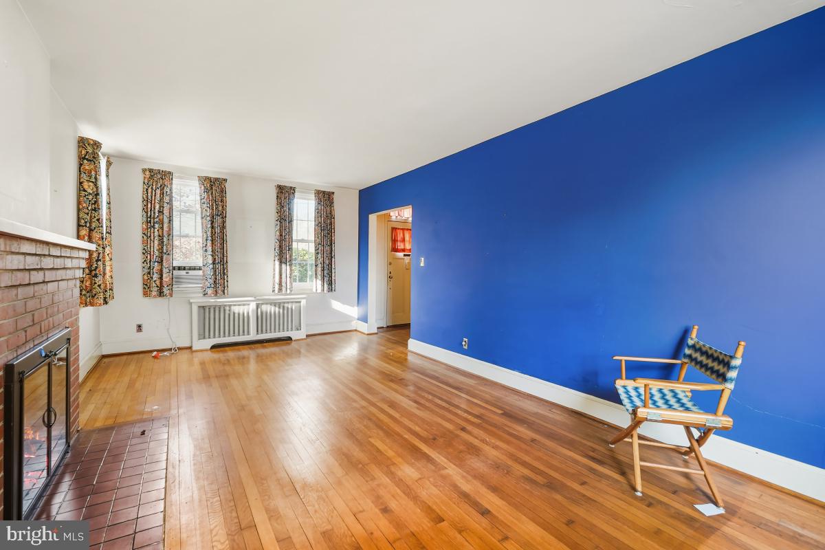 6540 Wiscasset Road Bethesda, MD 20816 - Photo 9 of 33 a view of an empty room with a window and wooden floor