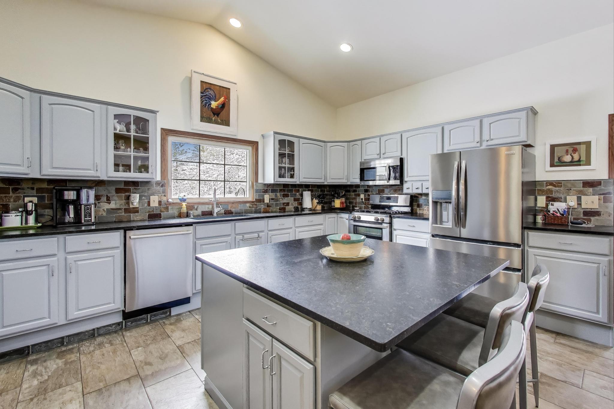 W312S8869 Cherokee Pass Mukwonago, WI 53149 - Photo 16 of 75 Kitchen with large island.