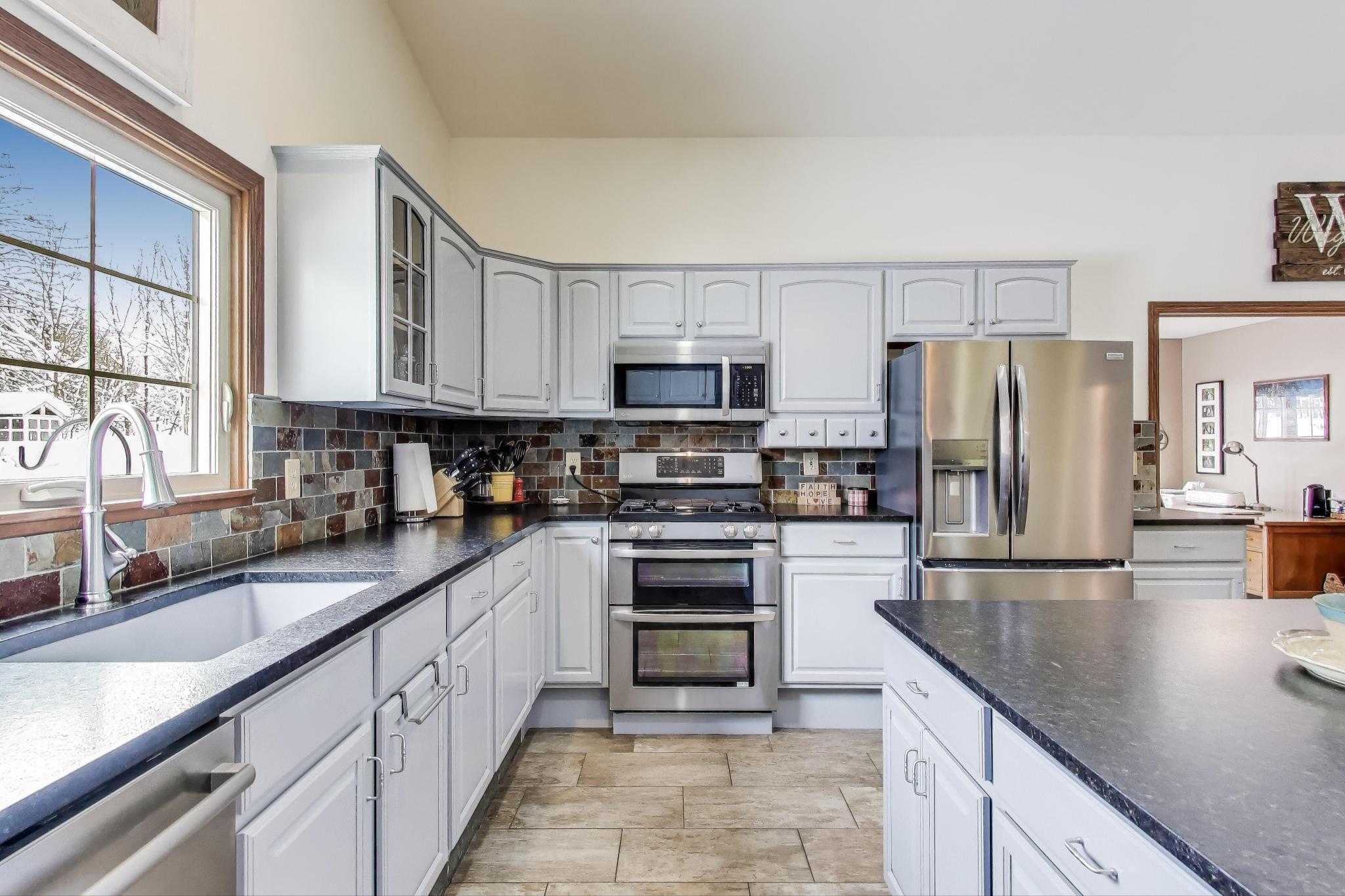 W312S8869 Cherokee Pass Mukwonago, WI 53149 - Photo 19 of 75 Kitchen has stainless steel appliances.