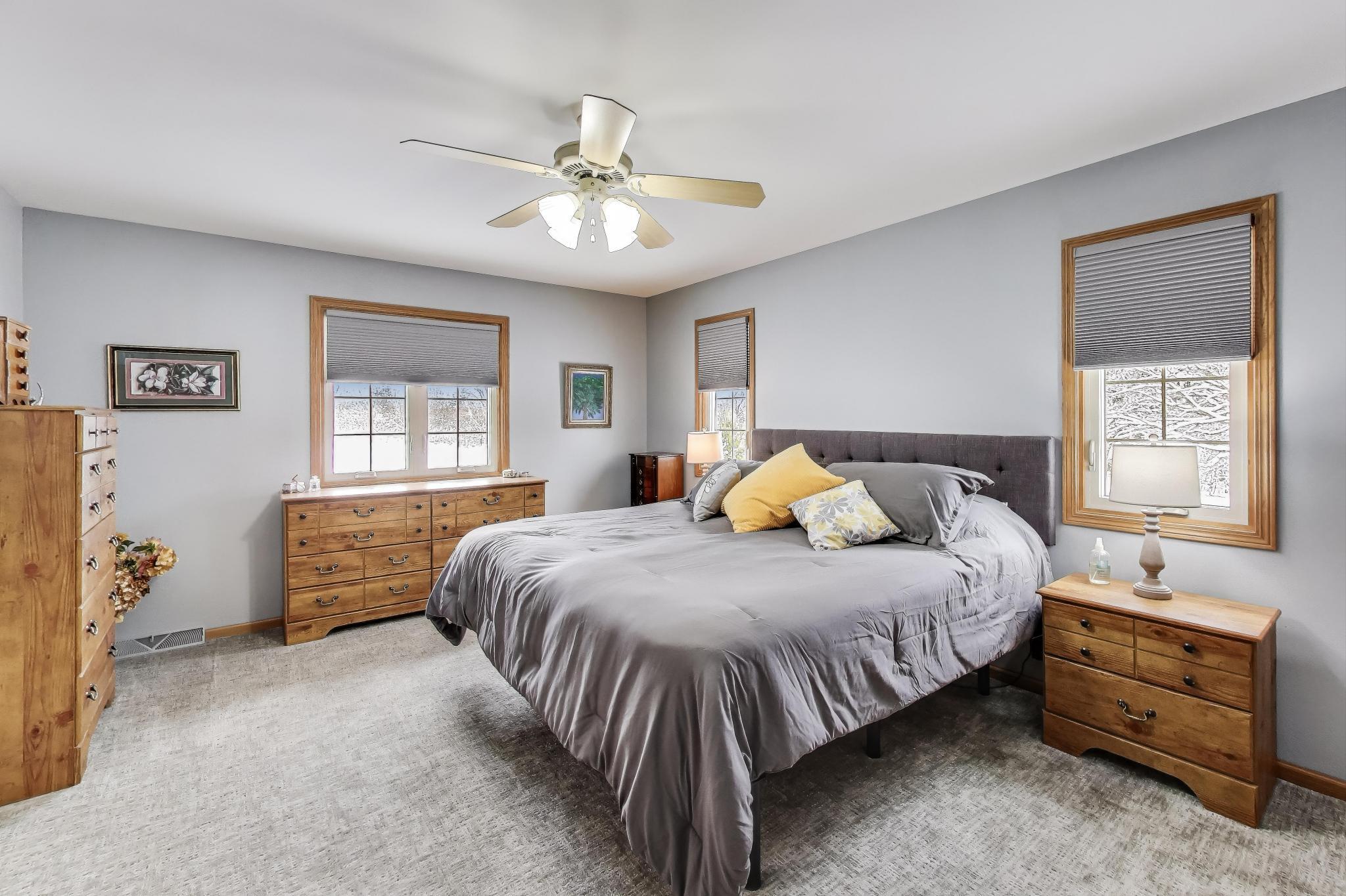 W312S8869 Cherokee Pass Mukwonago, WI 53149 - Photo 22 of 75 Large Primary bedroom with a great view of the back.