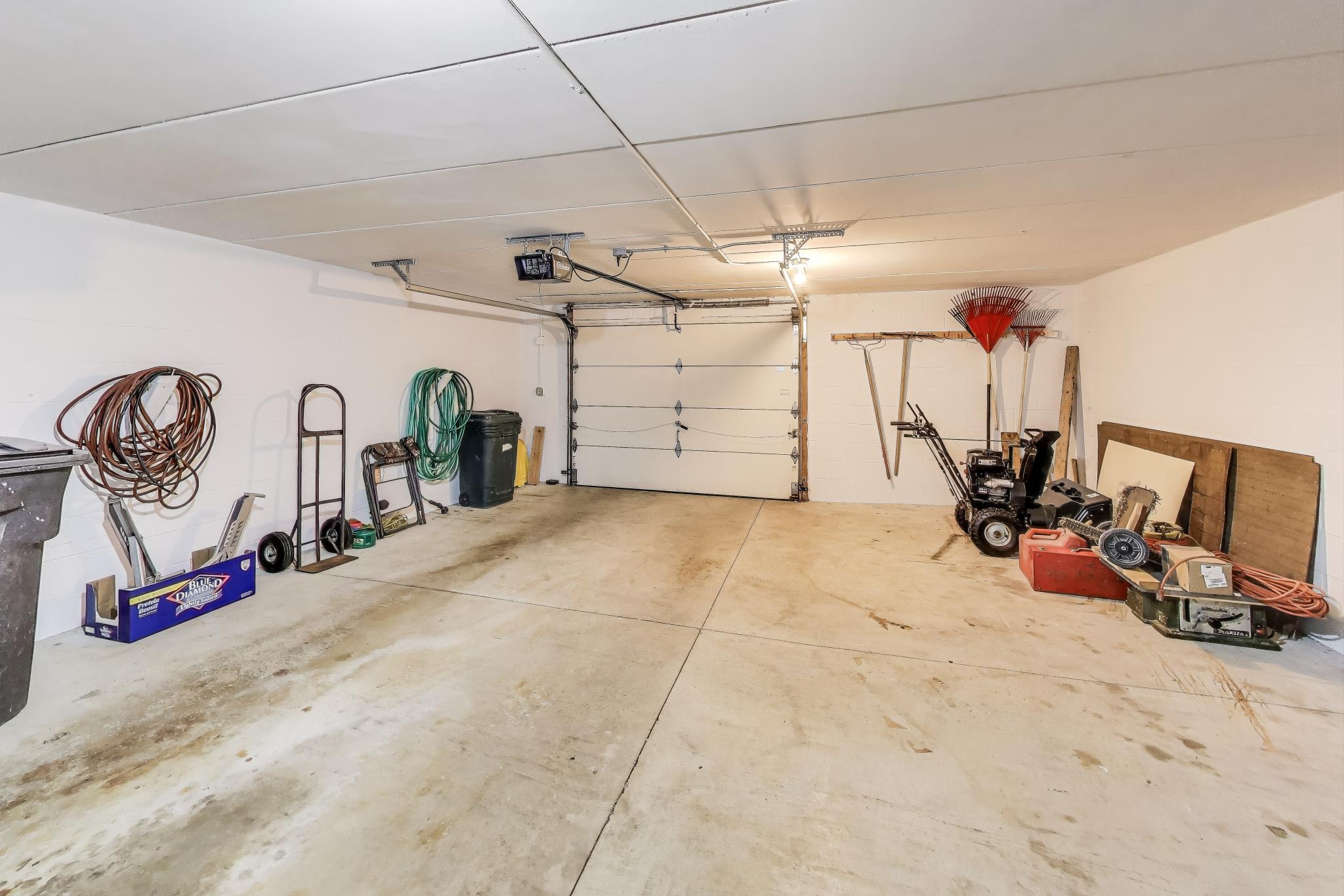 W312S8869 Cherokee Pass Mukwonago, WI 53149 - Photo 55 of 75 1 car garage with storage or workshop area on lower level