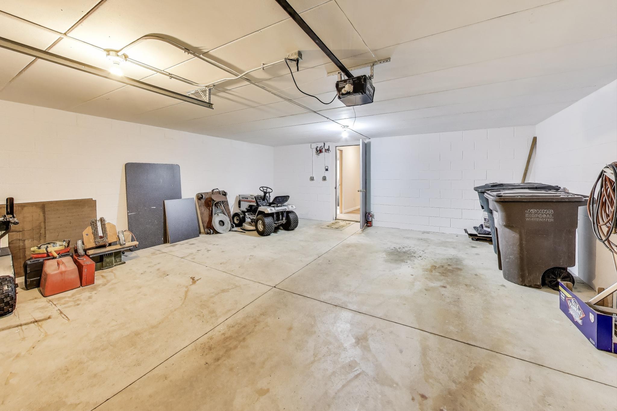 W312S8869 Cherokee Pass Mukwonago, WI 53149 - Photo 56 of 75 1 car garage with storage or workshop area on lower level