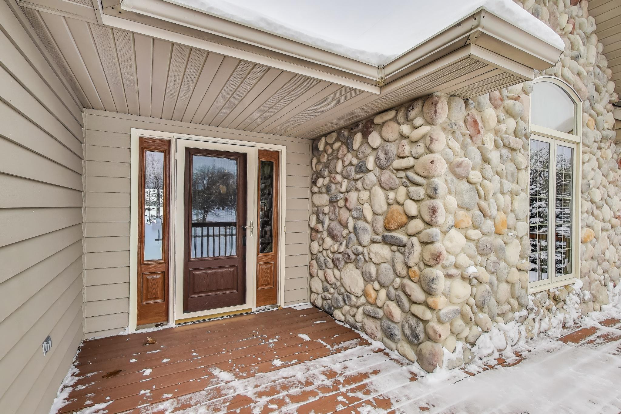W312S8869 Cherokee Pass Mukwonago, WI 53149 - Photo 5 of 75 Front door entry on wood deck.