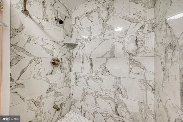 a bathroom with a sink and mirror