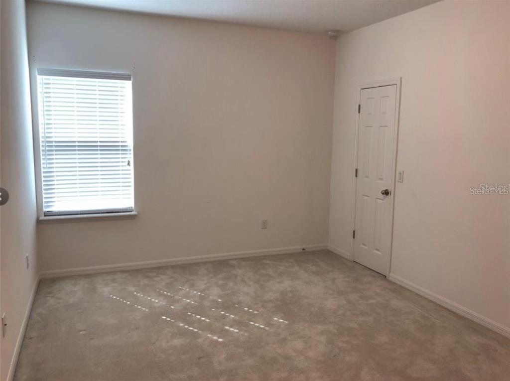14903 Fells Lane Orlando, FL 32827 - Photo 13 of 14 an empty room with a window