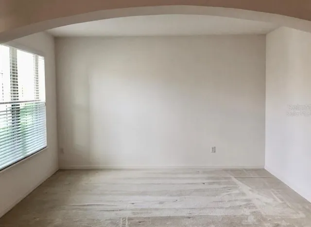 a view of an empty room and window