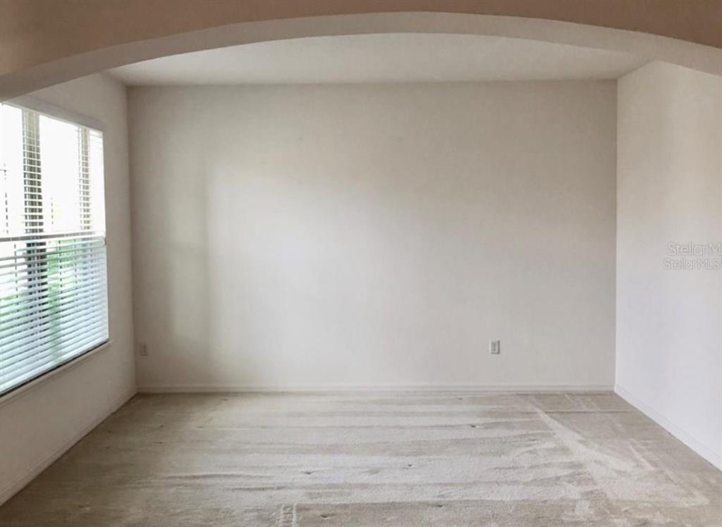 14903 Fells Lane Orlando, FL 32827 - Photo 3 of 14 a view of an empty room and window