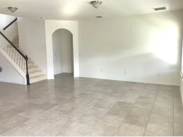 a view of a room with drop ceiling