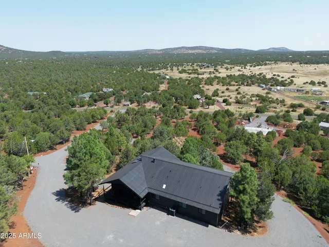 an aerial view of residential house and outdoor space