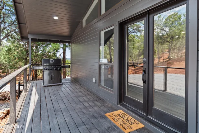 a view of a balcony with wooden floor