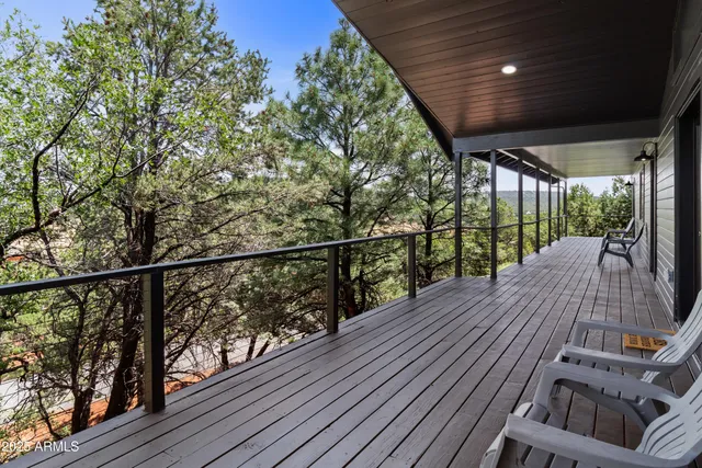 a view of balcony with wooden floor