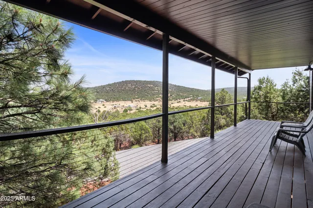 a view of balcony with wooden floor