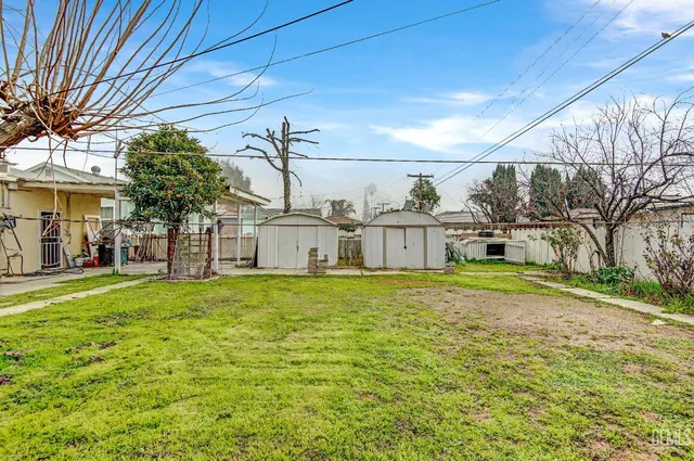 a view of a big yard with potted plants