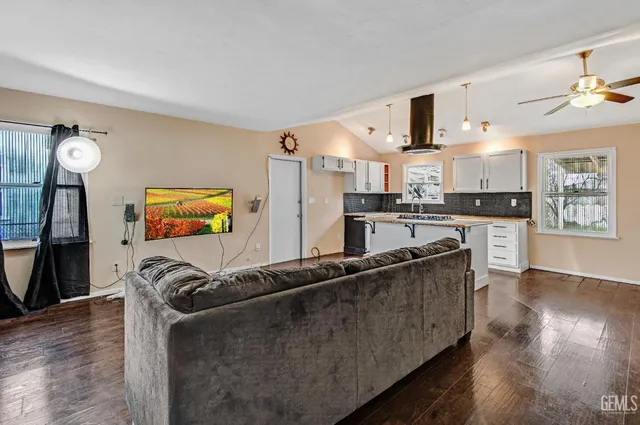 a kitchen with stainless steel appliances granite countertop a stove and a sink