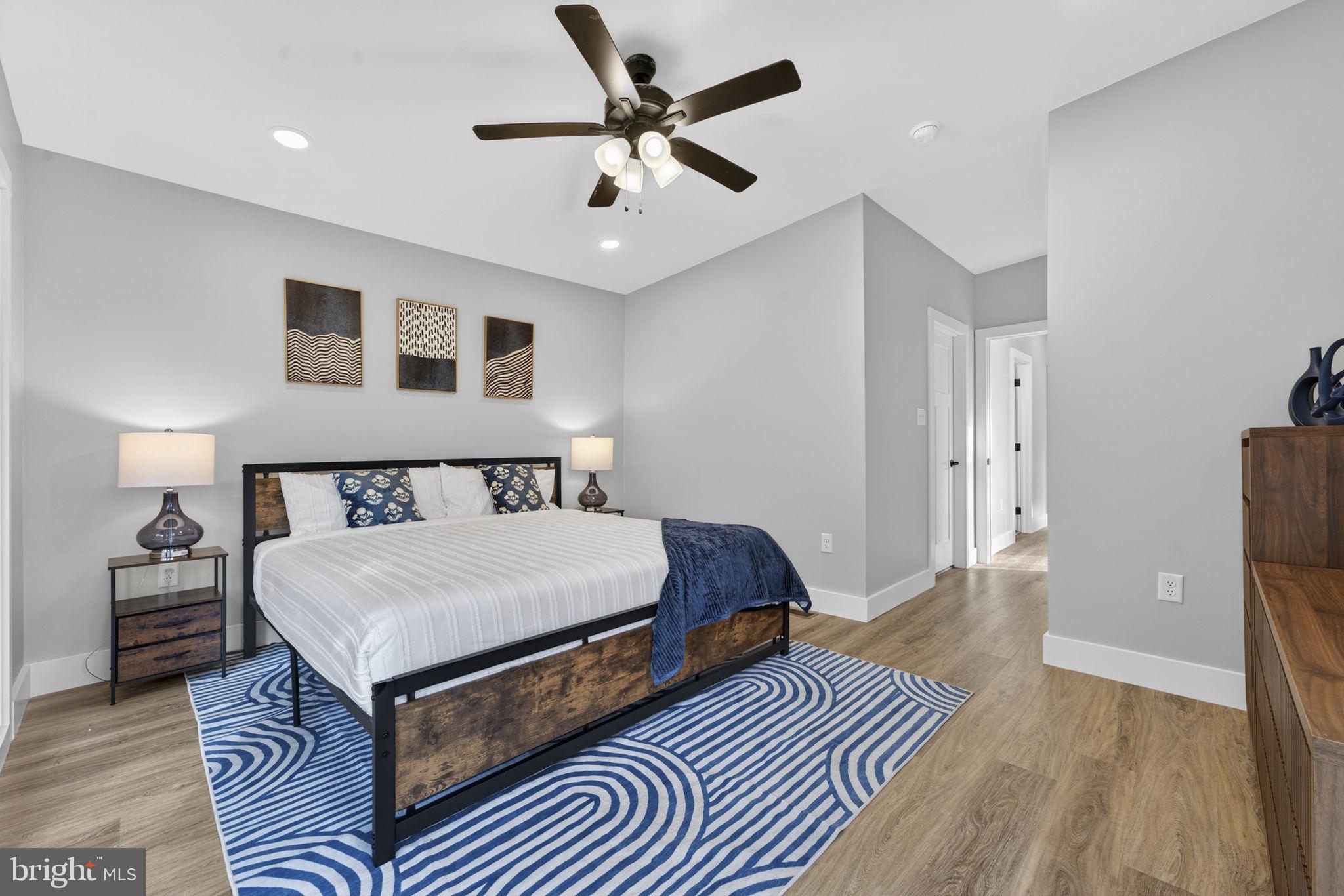 1956 Dove Hollow Road Mathias, WV 26812 - Photo 61 of 113 a spacious bedroom with a bed and a chandelier