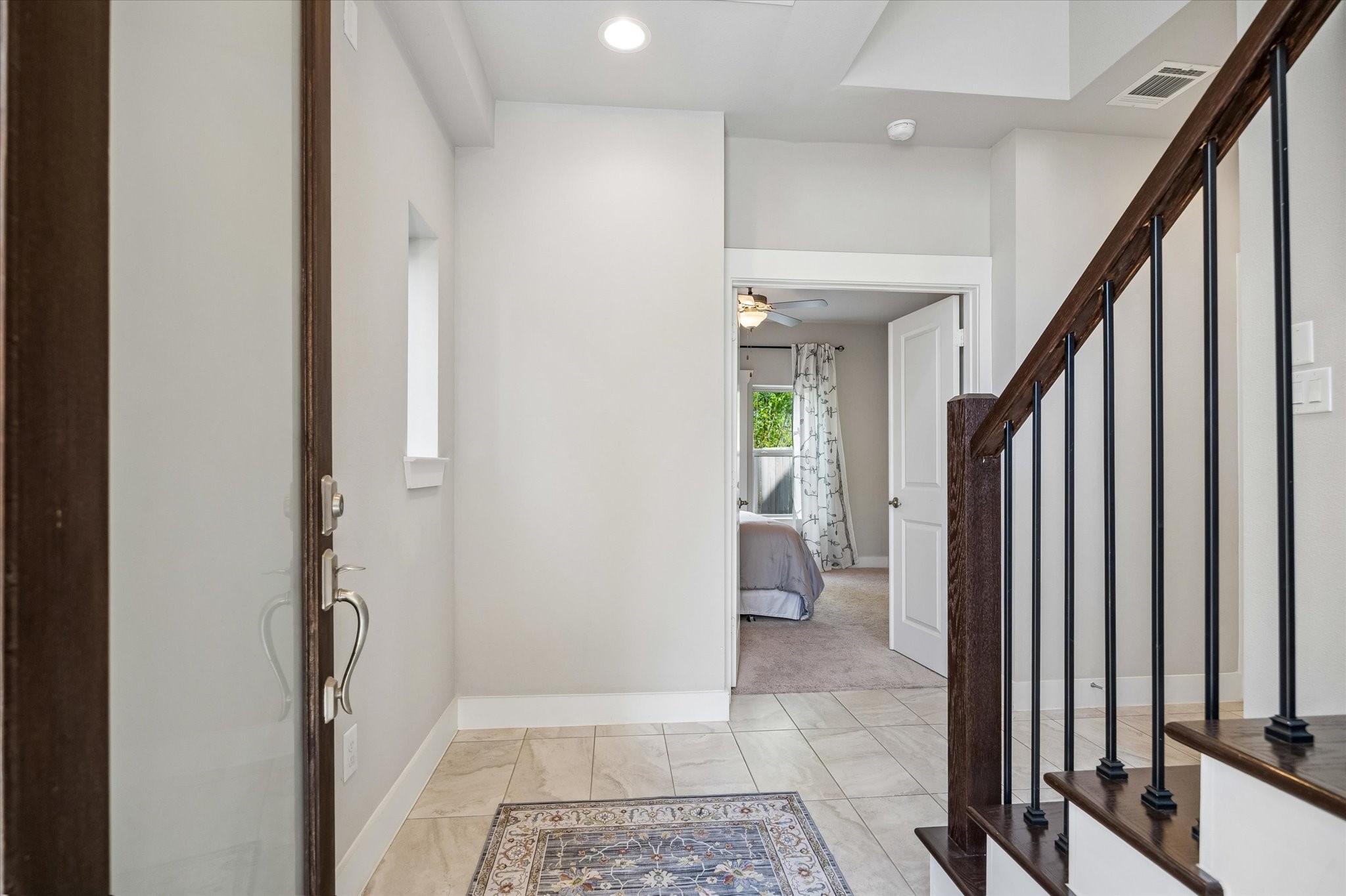 2103 Patterson Street Houston, TX 77007 - Photo 21 of 27 a view of an entryway with wooden floor and a livingroom view