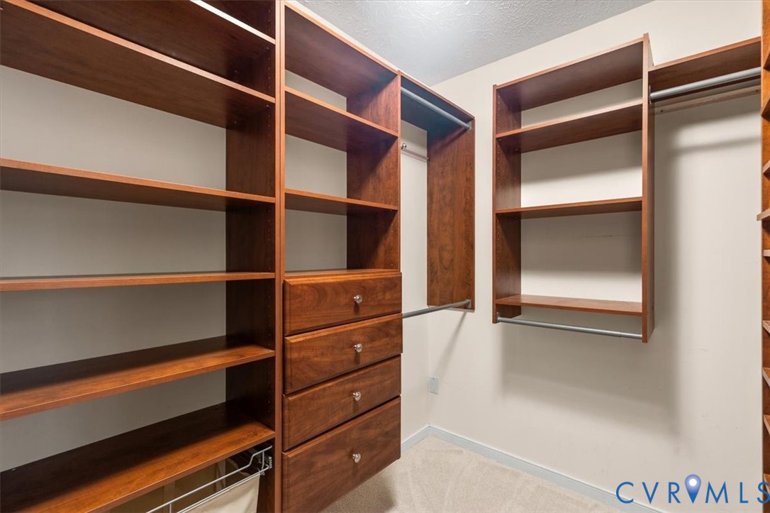 1437 Palmore Road Powhatan, VA 23139 - Photo 32 of 60 Custom closet system featuring rich wood-finish sh