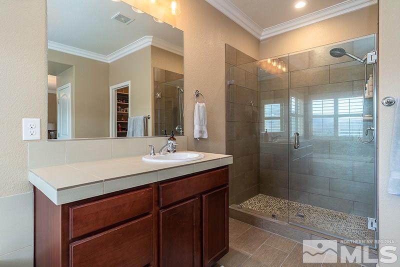 1640 Back Nine Trail Reno, NV 89523 - Photo 20 of 35 a bathroom with a sink shower and a mirror