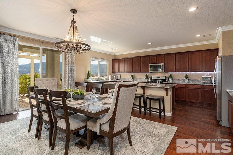 1640 Back Nine Trail Reno, NV 89523 - Photo 3 of 35 a view of a dining room with furniture window and wooden floor