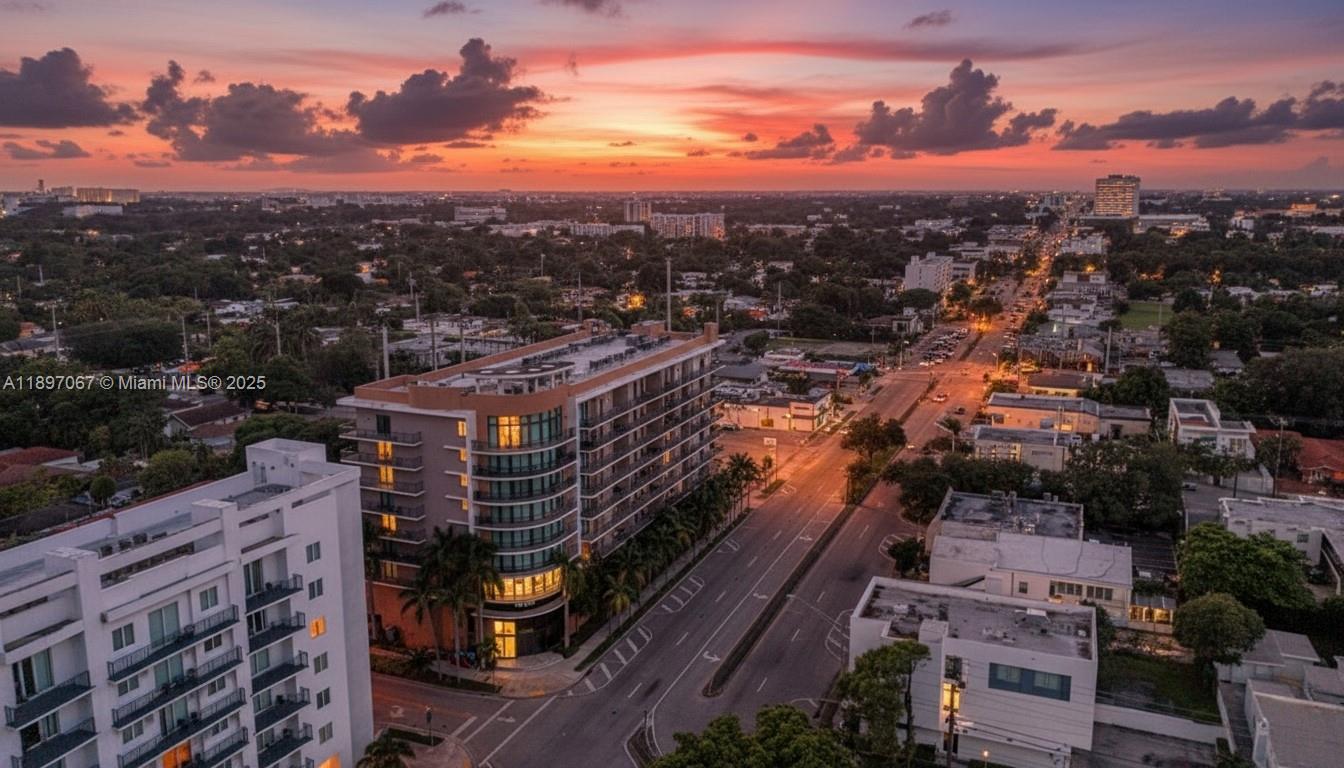 1690 Southwest 27th Avenue, Unit 603 Miami, FL 33145 - Photo 1 of 41 a view of a city with tall buildings
