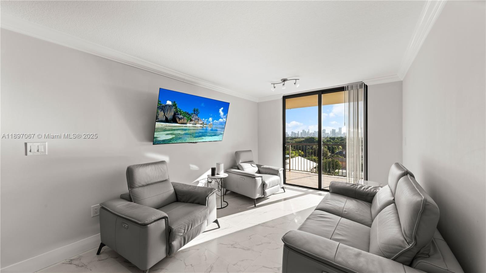 1690 Southwest 27th Avenue, Unit 603 Miami, FL 33145 - Photo 11 of 41 a living room with furniture and a large window