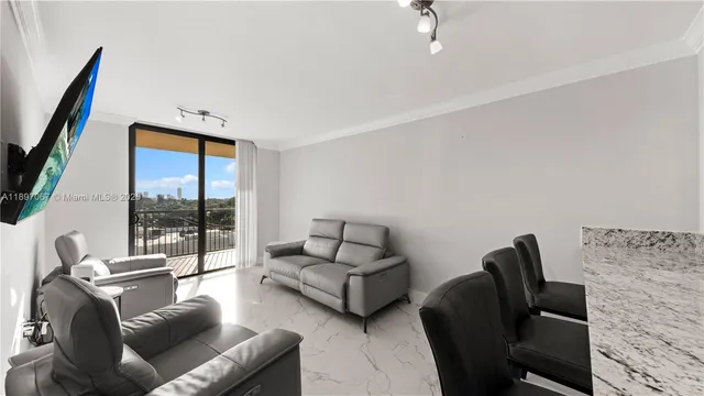 a living room with furniture rug and a flat screen tv