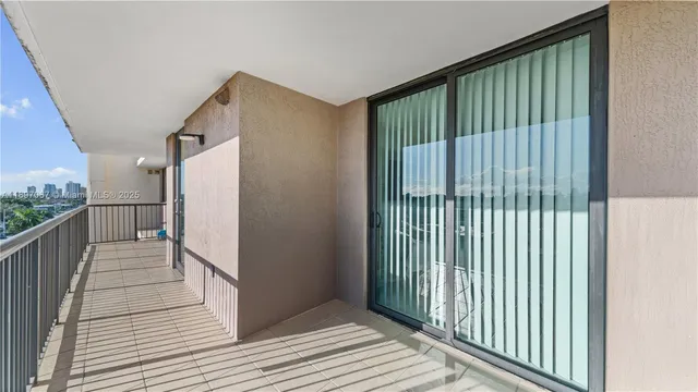 a view of a balcony with wooden floor