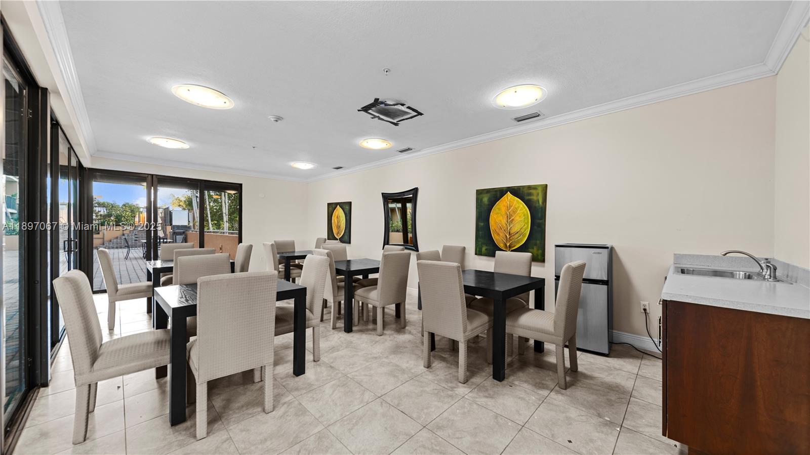 1690 Southwest 27th Avenue, Unit 603 Miami, FL 33145 - Photo 29 of 41 a view of a dining room with furniture