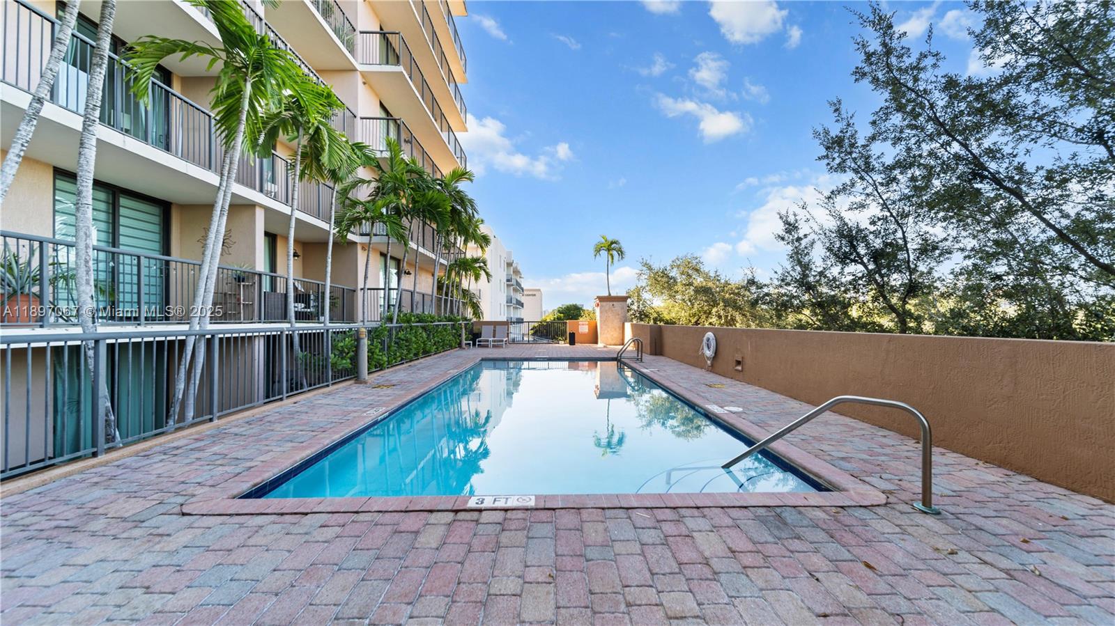 1690 Southwest 27th Avenue, Unit 603 Miami, FL 33145 - Photo 31 of 41 swimming pool view with a outdoor seating