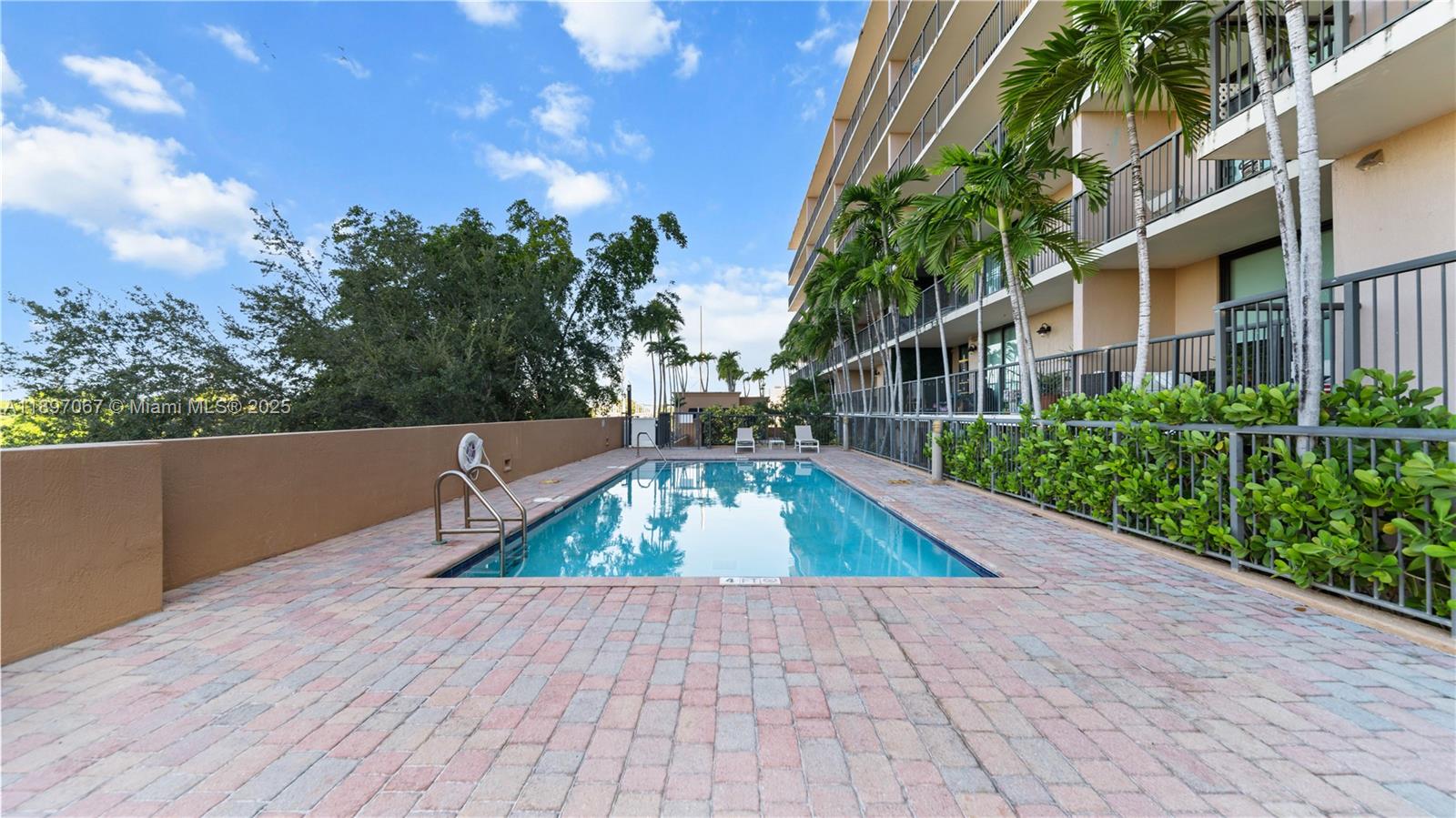 1690 Southwest 27th Avenue, Unit 603 Miami, FL 33145 - Photo 32 of 41 a view of outdoor space with deck and yard