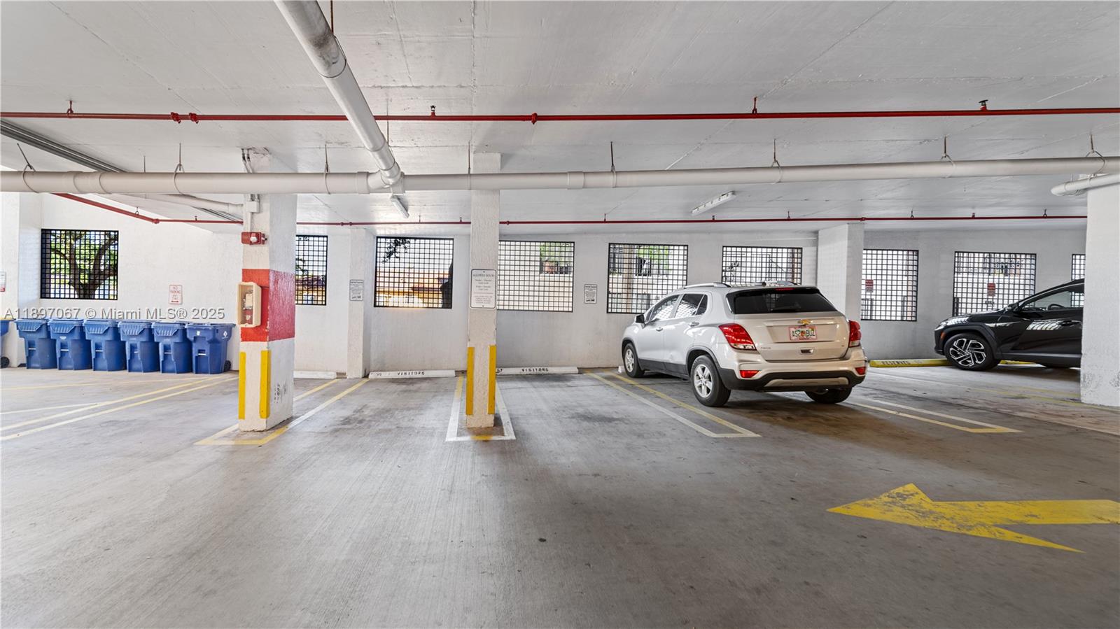 1690 Southwest 27th Avenue, Unit 603 Miami, FL 33145 - Photo 41 of 41 a view of a parking space with car parked