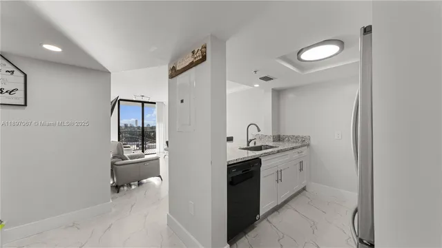 a spacious bathroom with a sink and a mirror