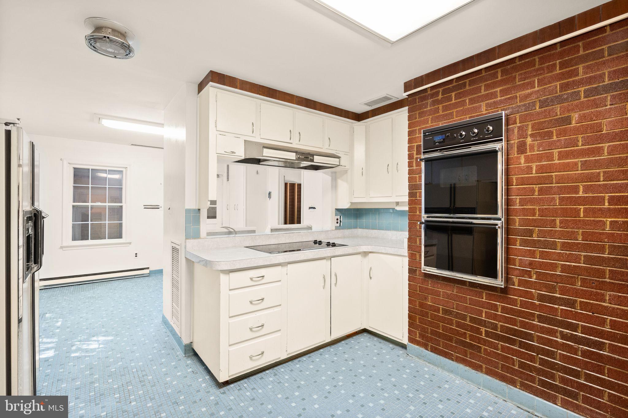 8311 Pohick Road Springfield, VA 22153 - Photo 24 of 92 a kitchen with stainless steel appliances granite countertop a stove and a refrigerator