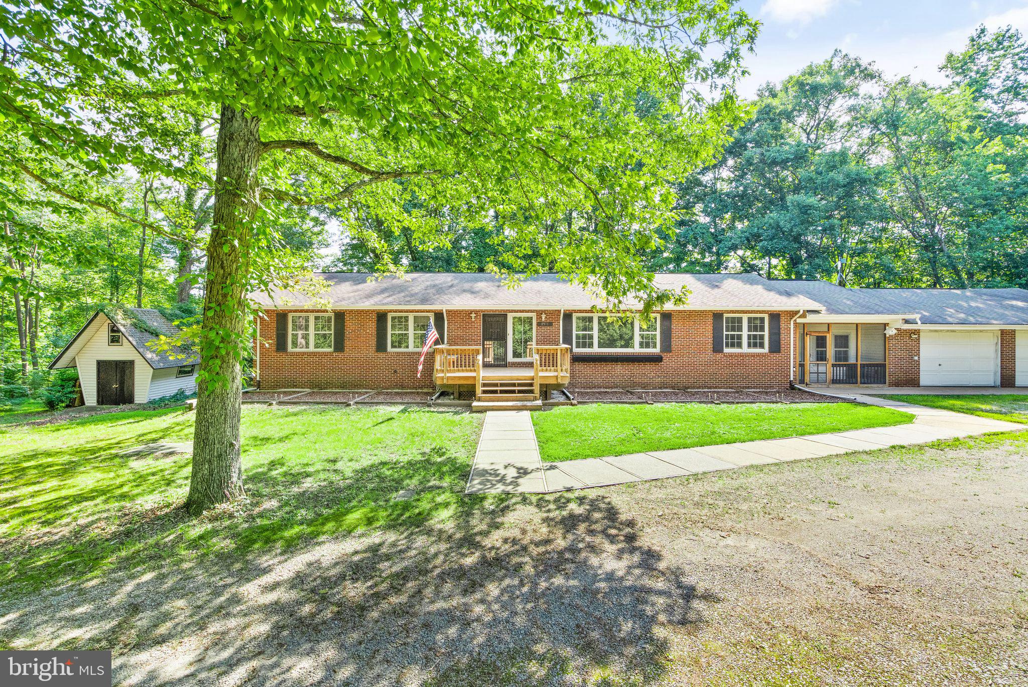 8311 Pohick Road Springfield, VA 22153 - Photo 4 of 92 a view of a house with backyard and a garden