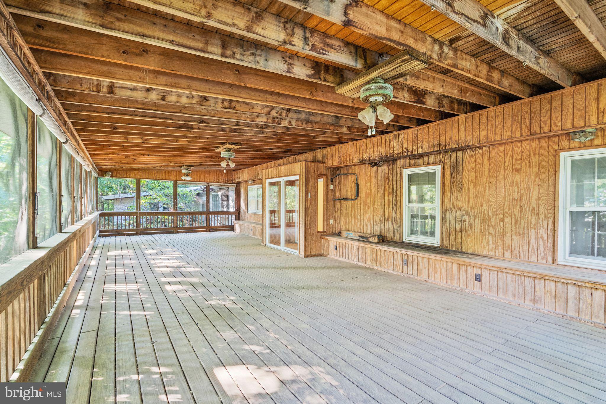 8311 Pohick Road Springfield, VA 22153 - Photo 48 of 92 a view of a porch with wooden floor and city view