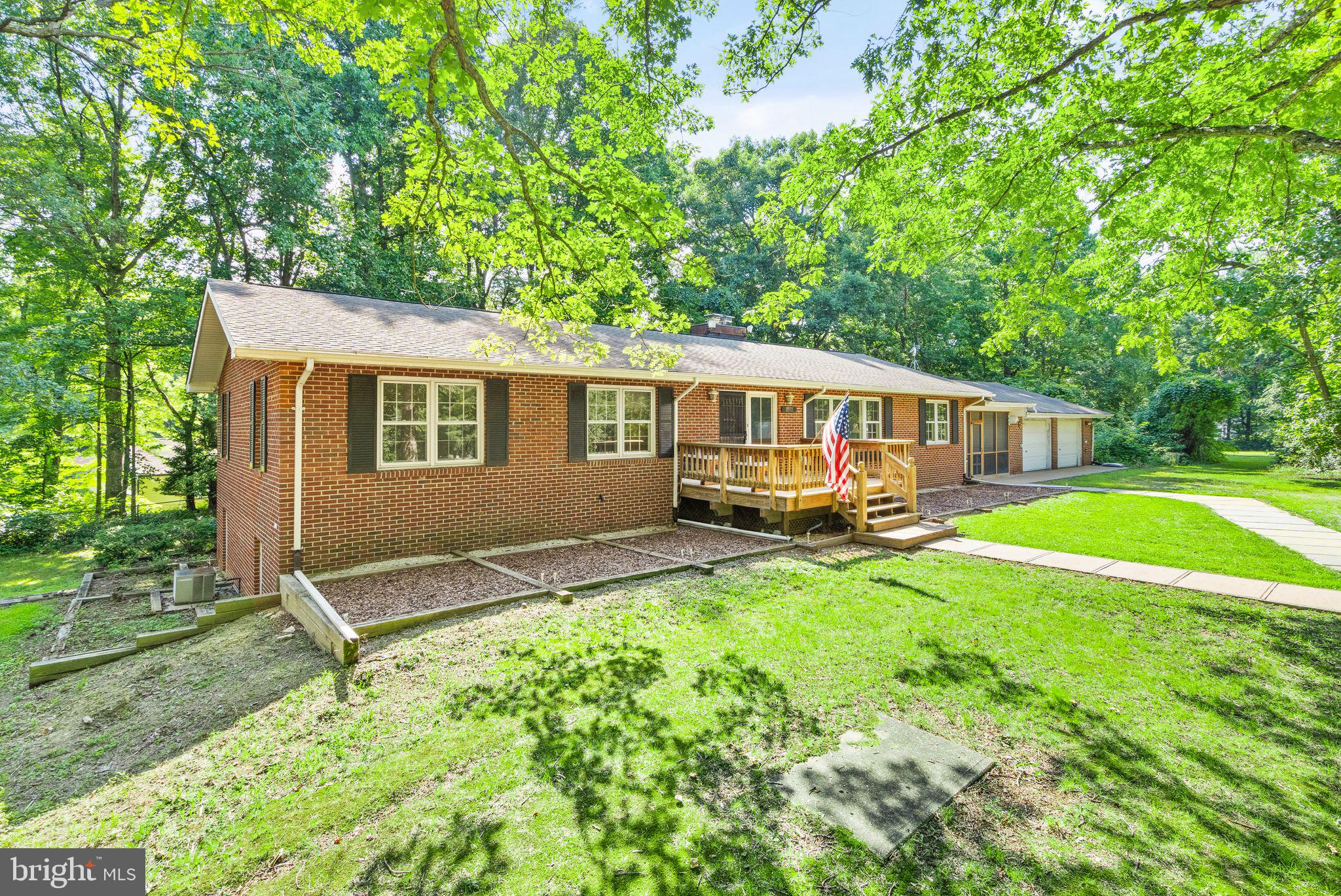 8311 Pohick Road Springfield, VA 22153 - Photo 5 of 92 a view of a house with backyard and sitting area