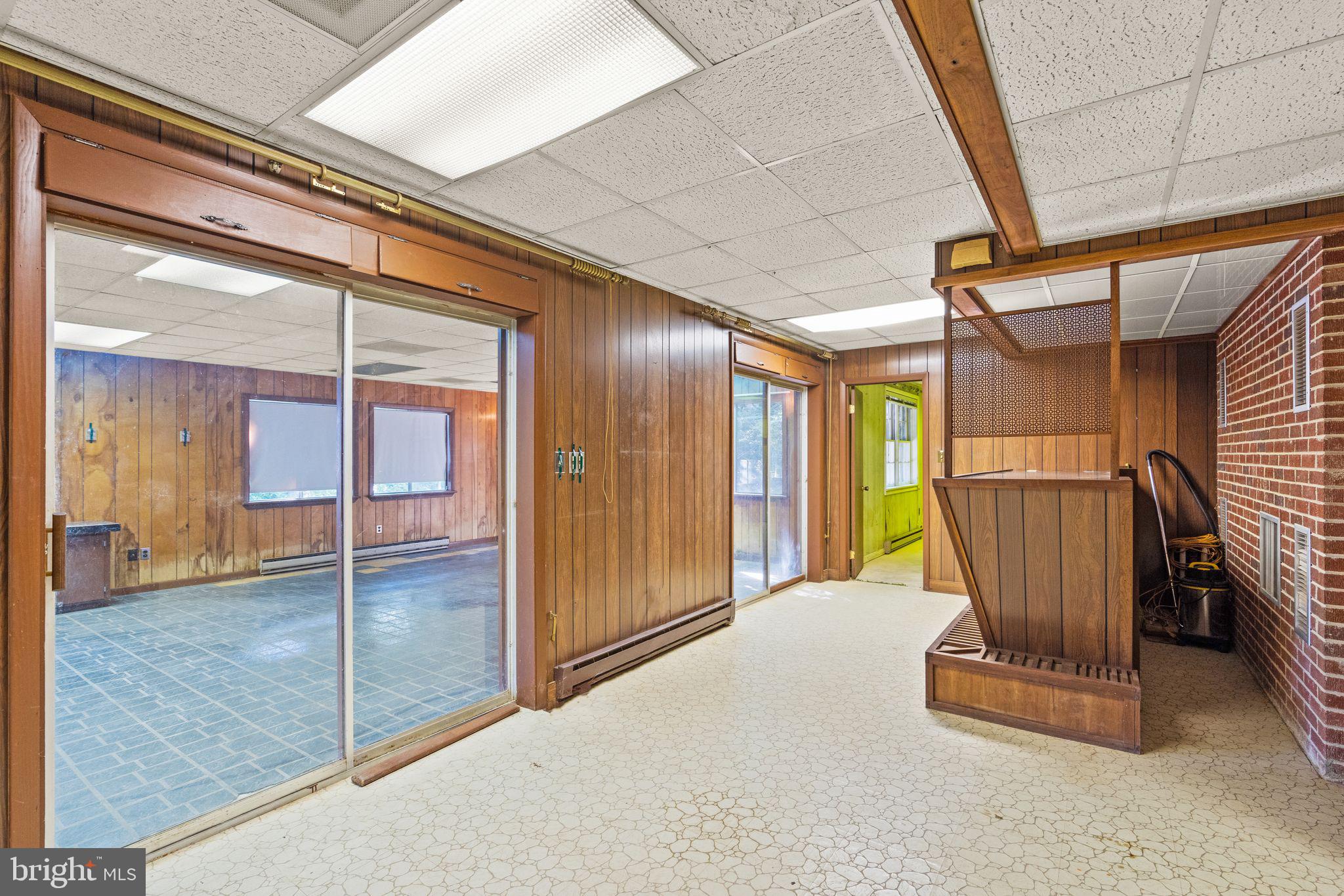 8311 Pohick Road Springfield, VA 22153 - Photo 51 of 92 a view of a hallway with glass door