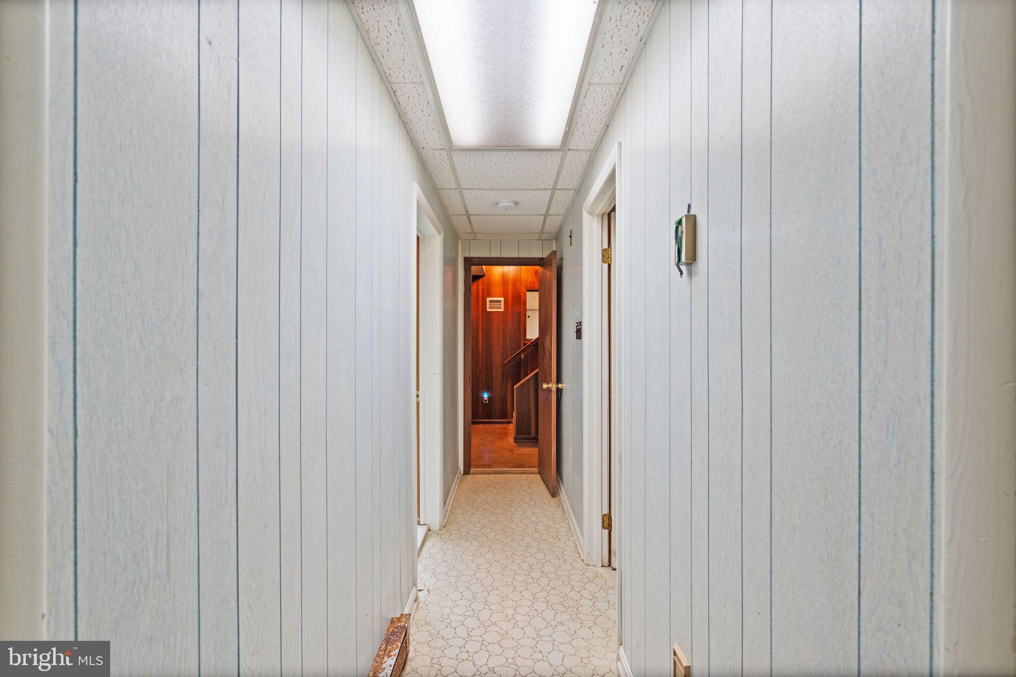 8311 Pohick Road Springfield, VA 22153 - Photo 66 of 92 Basement Hallway leading to Bedrooms