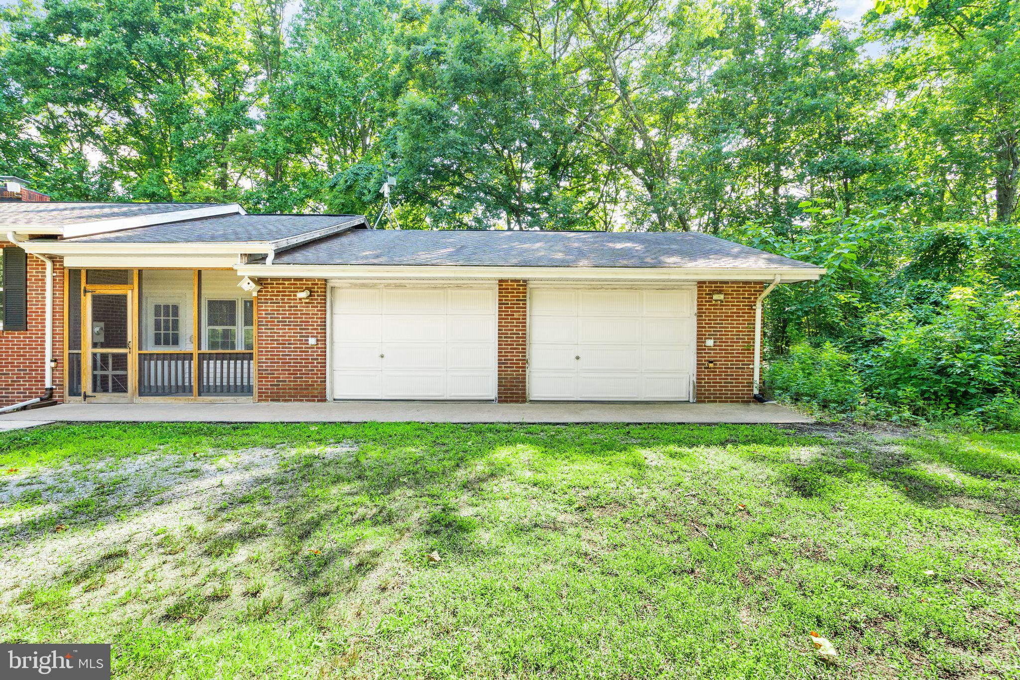 8311 Pohick Road Springfield, VA 22153 - Photo 7 of 92 front view of a house with a yard