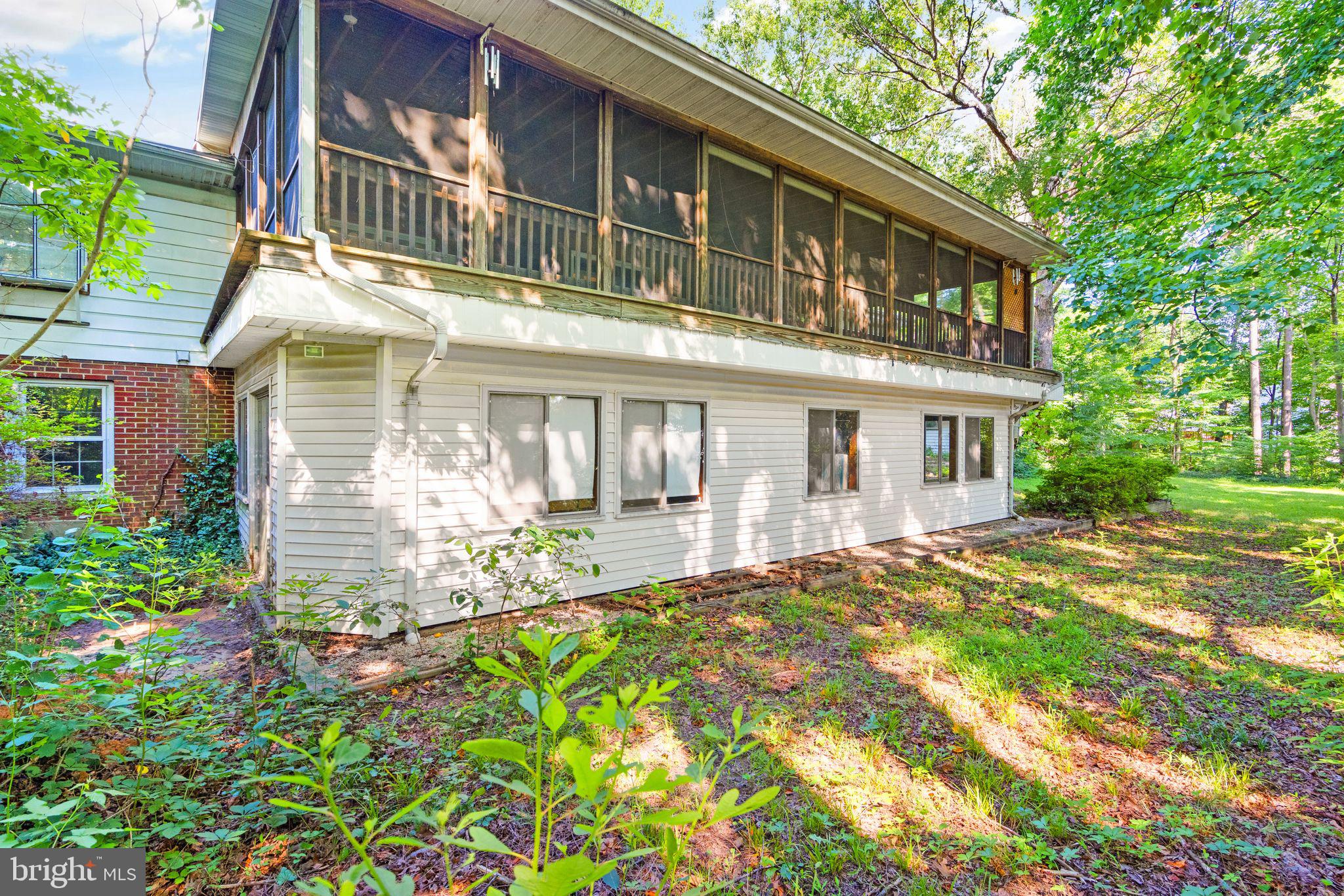 8311 Pohick Road Springfield, VA 22153 - Photo 74 of 92 a front view of a house with a yard
