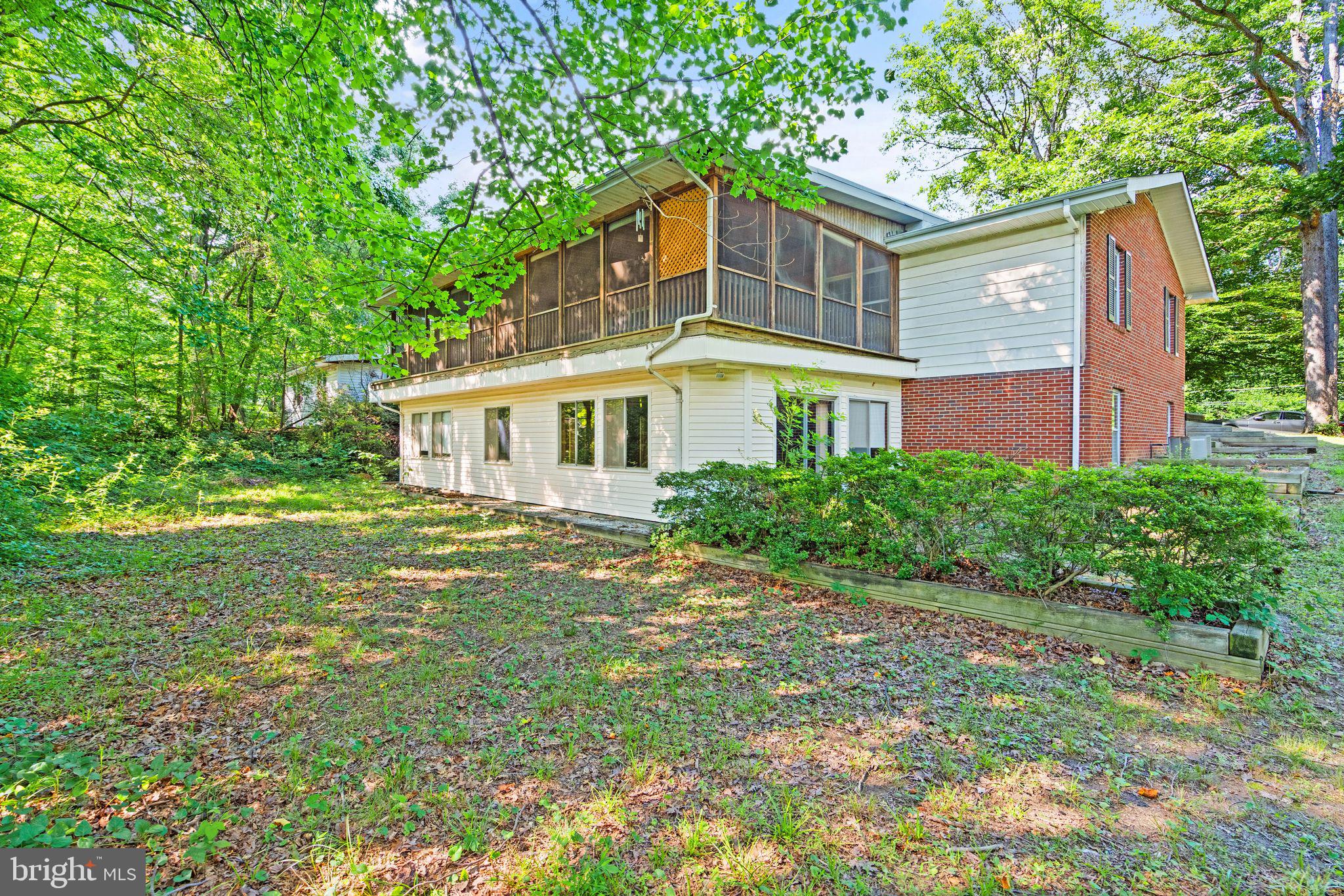 8311 Pohick Road Springfield, VA 22153 - Photo 75 of 92 a front view of a house with a yard