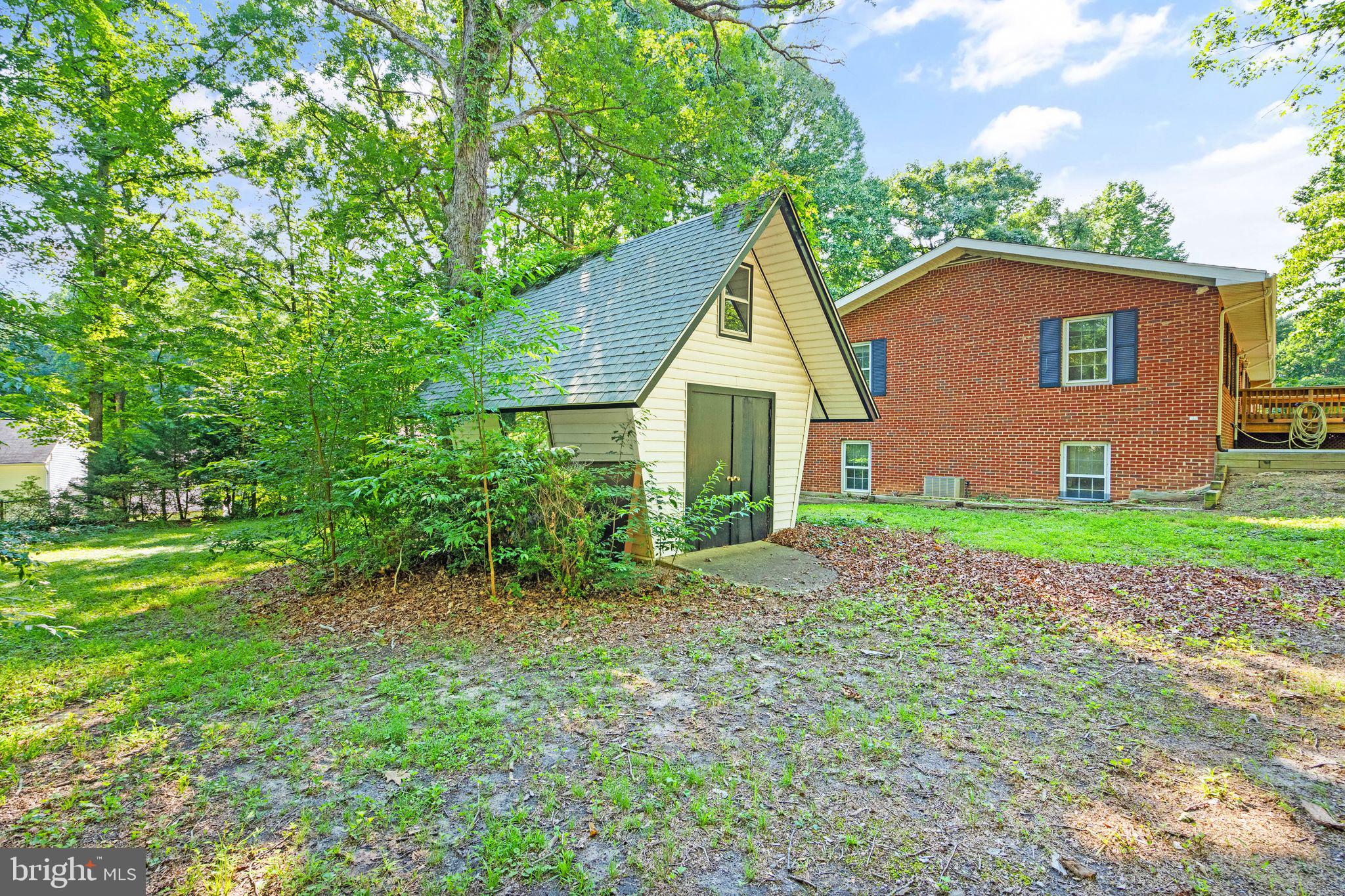 8311 Pohick Road Springfield, VA 22153 - Photo 79 of 92 a view of a house with a yard