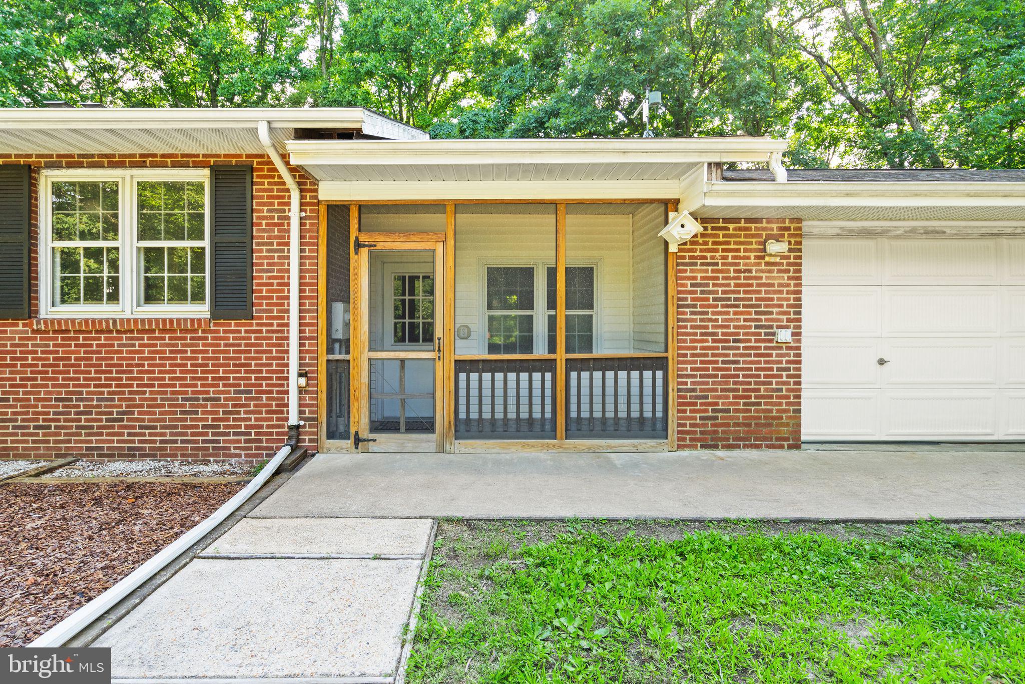 8311 Pohick Road Springfield, VA 22153 - Photo 8 of 92 a view of a porch with a small yard