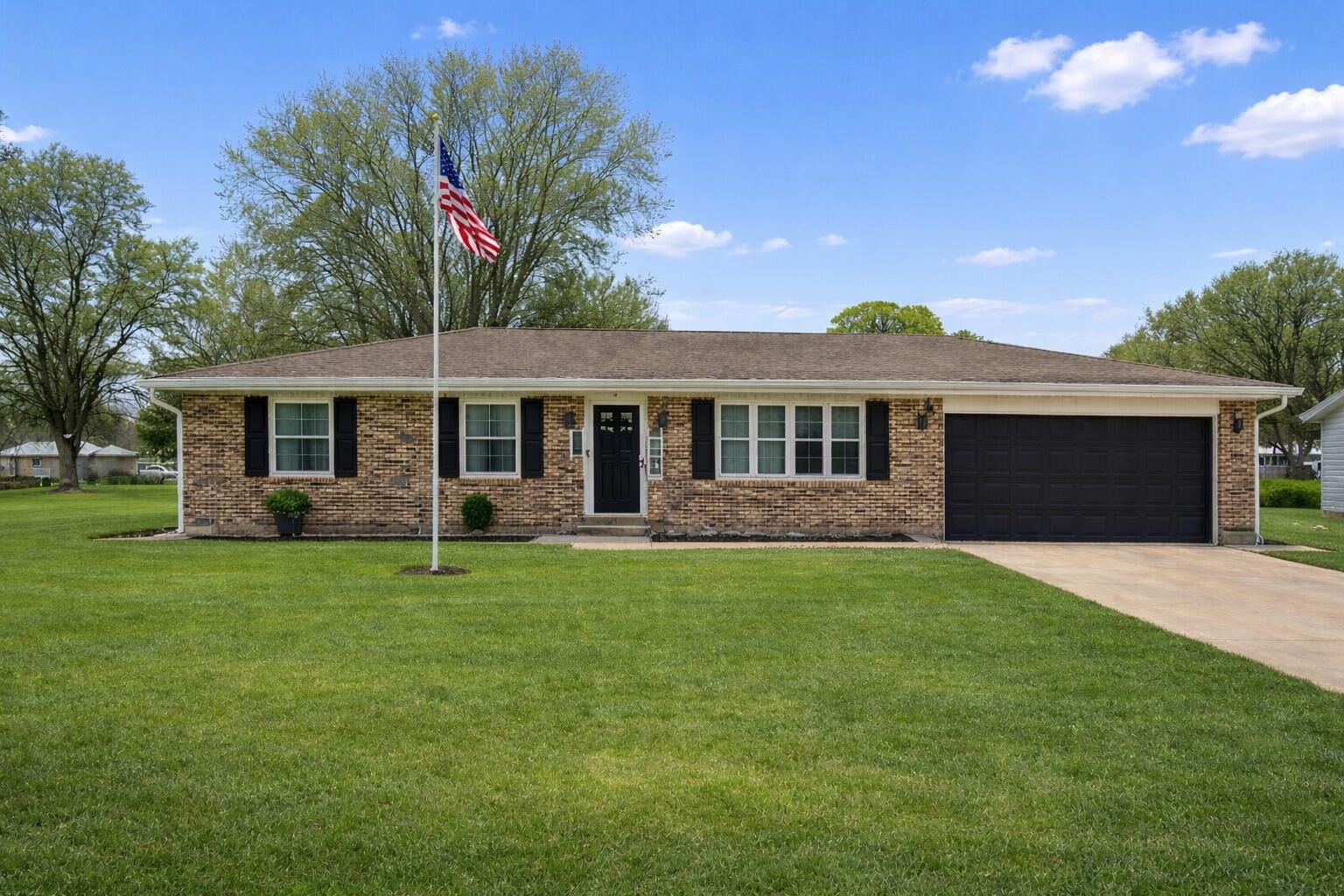 2934 Parker Street Portage, IN 46368 - Photo 1 of 16 a front view of a house with a garden