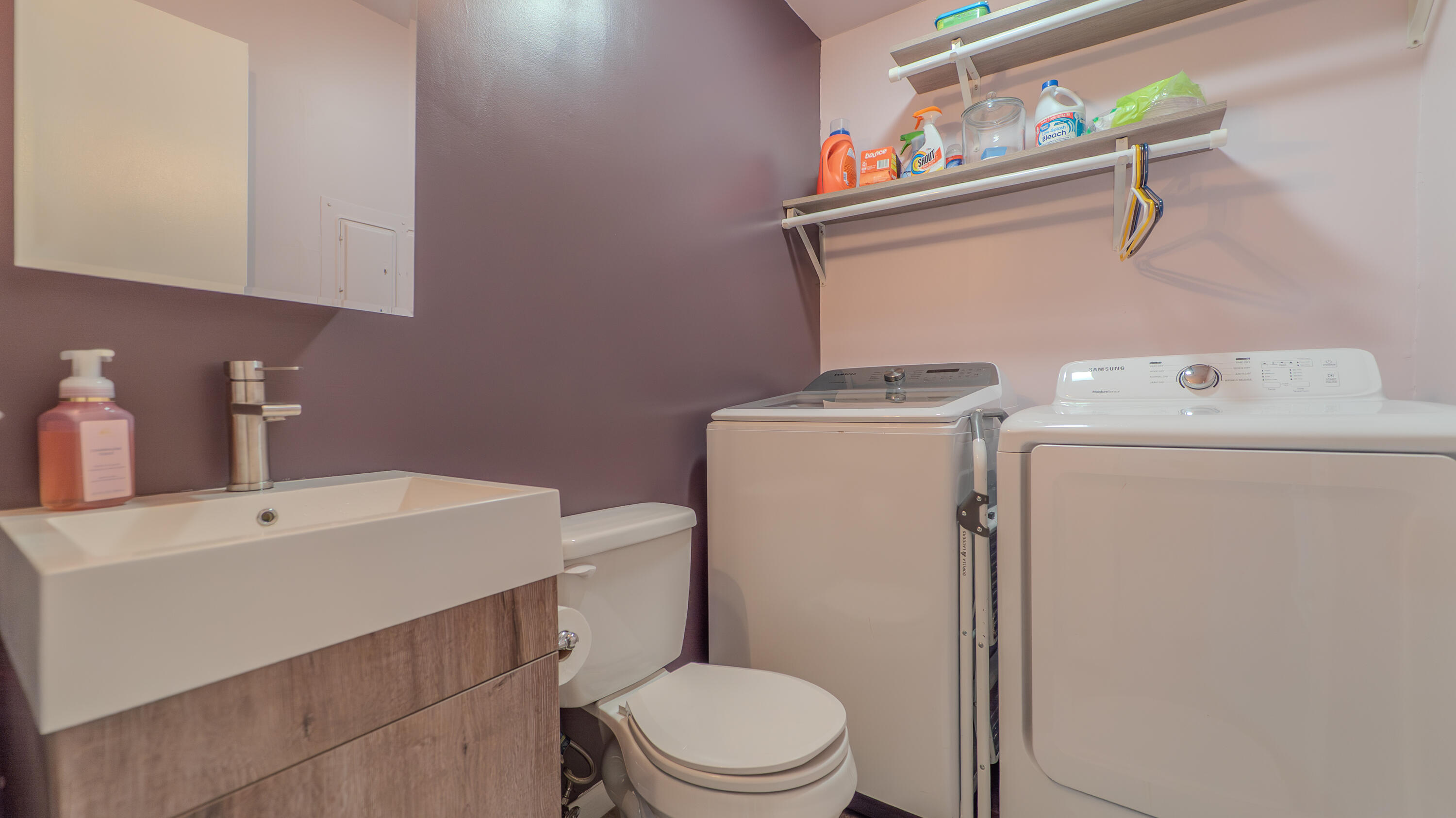 2934 Parker Street Portage, IN 46368 - Photo 16 of 16 a bathroom with a sink a toilet and a mirror