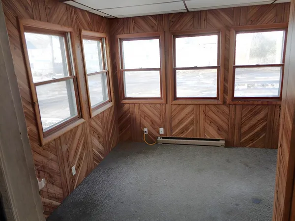 a view of an empty room and window