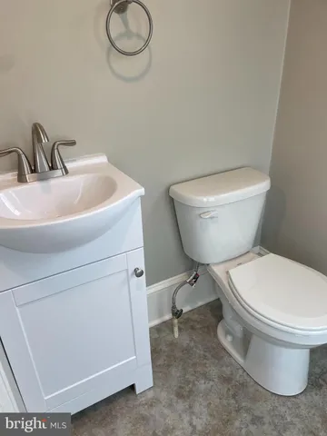a bathroom with a toilet and a sink