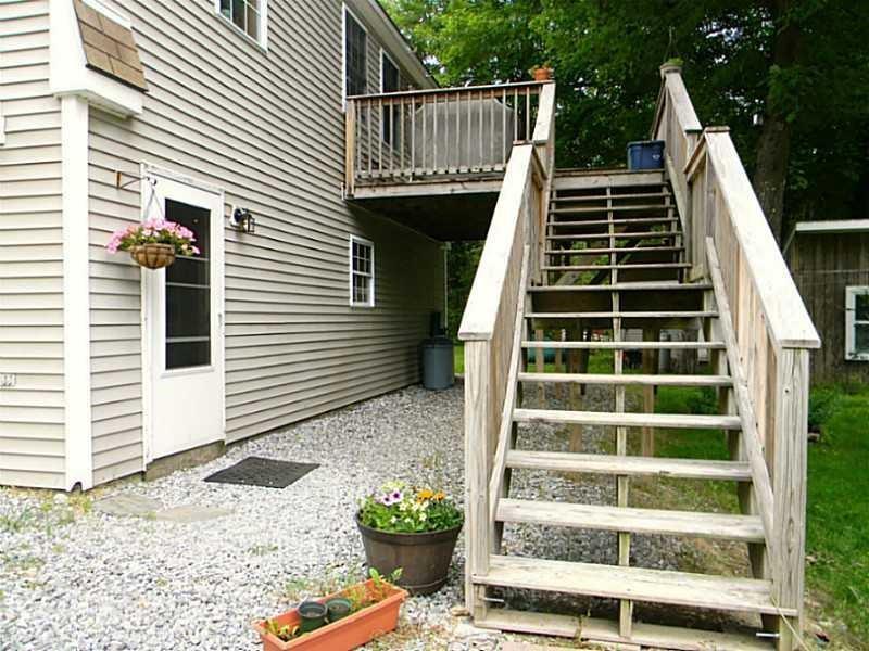 67 Maple Grove South China, ME 04358 - Photo 7 of 33 Front door and stairs to upper deck.