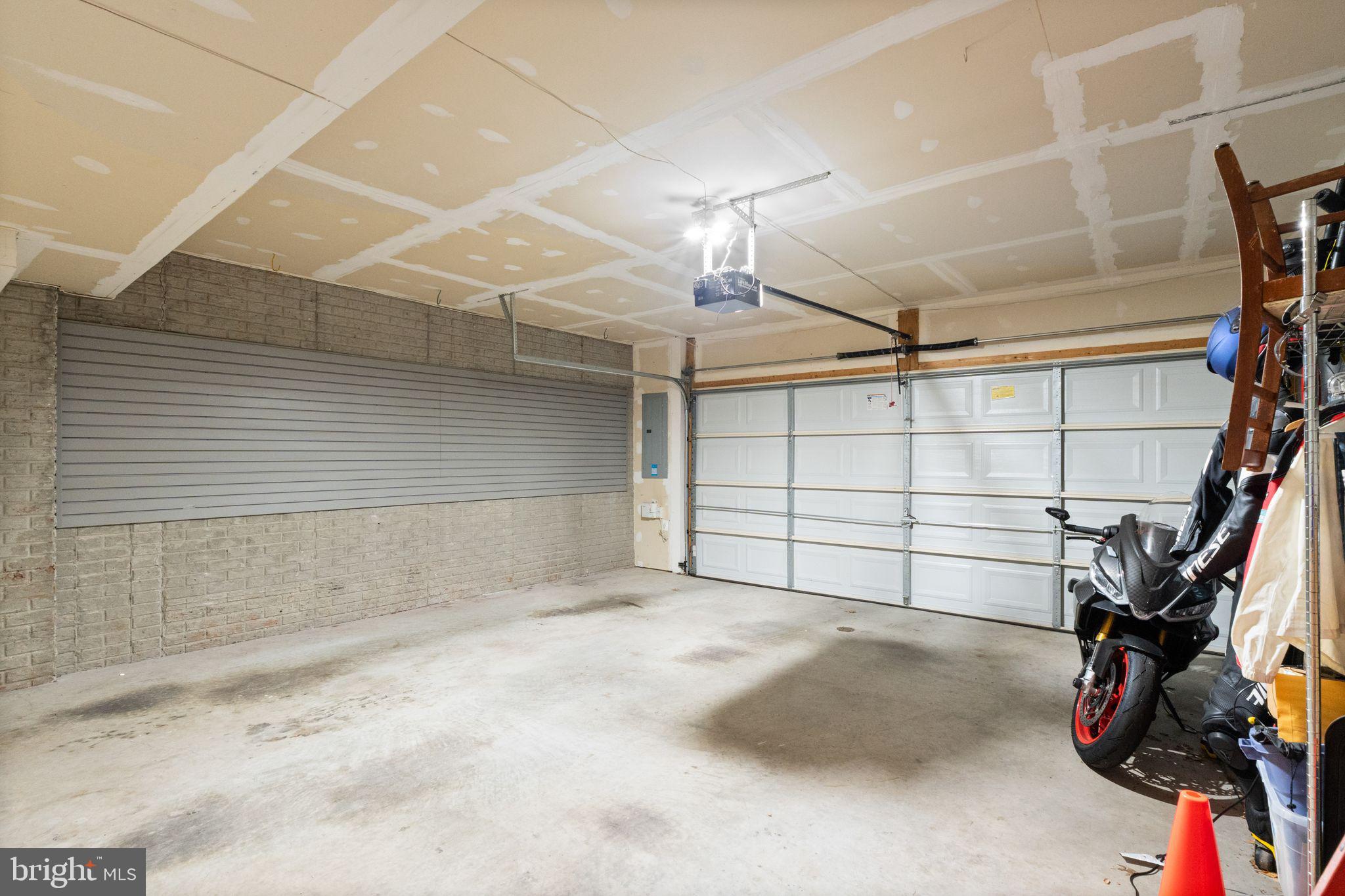 7015 Trek Way Gainesville, VA 20155 - Photo 46 of 56 2-car garage with slat-wall storage